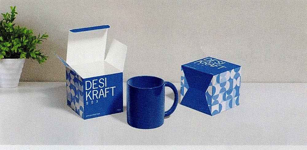 Printed blue mono cartons beside a mug